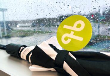 umbrella in rainy widow with Lextran logo