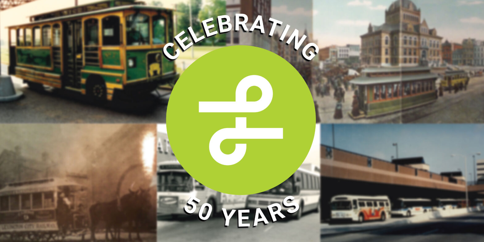 Image featuring Lextran's 50th anniversary logo prominently displayed in the foreground with blurred historical photos of Lextran's transportation service in the background. The logo celebrates five decades of public transit service, while the indistinct images behind it hint at the rich history of the organization.